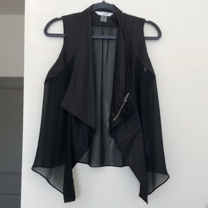 Peter Nygård black vest